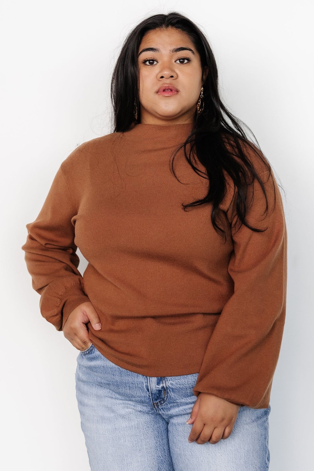 Close-up of the Sutton Sweater Top knit fabric in teddy-bear brown, focusing on the mock neckline and visible stitch texture for tactile detail.