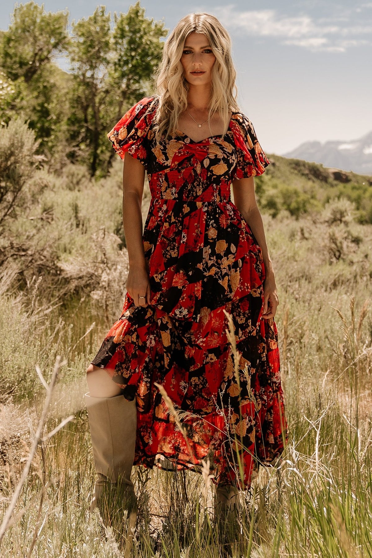 Front view of Suzy Maxi Dress in Black + Red Multi showing sweetheart neckline, ruched bust, smocked bodice back, and three-tier chiffon skirt for flow and movement.