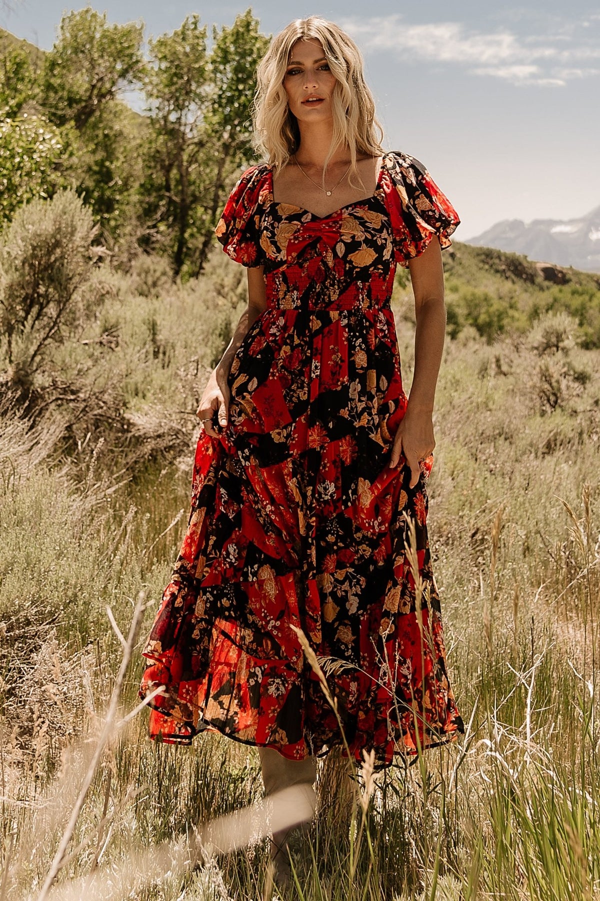 Fabric and print close-up of the Black + Red Multi Suzy Maxi Dress showing muted red, goldenrod yellow, cream and beige geometric floral motifs on chiffon.