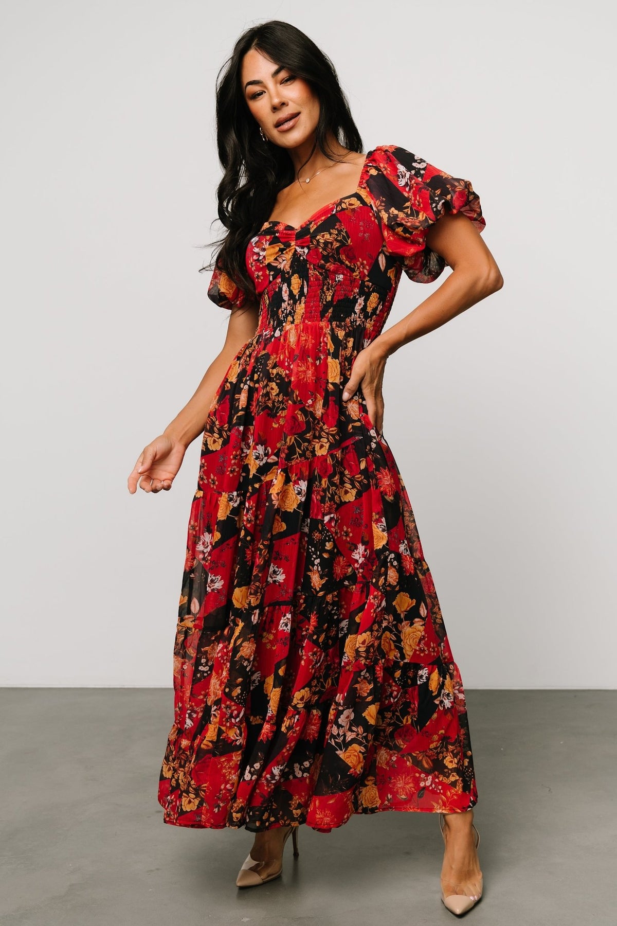 Close-up of the Suzy Maxi Dress sweetheart neckline and ruched center-seam bust in Black + Red Multi, highlighting the floral print and lining.