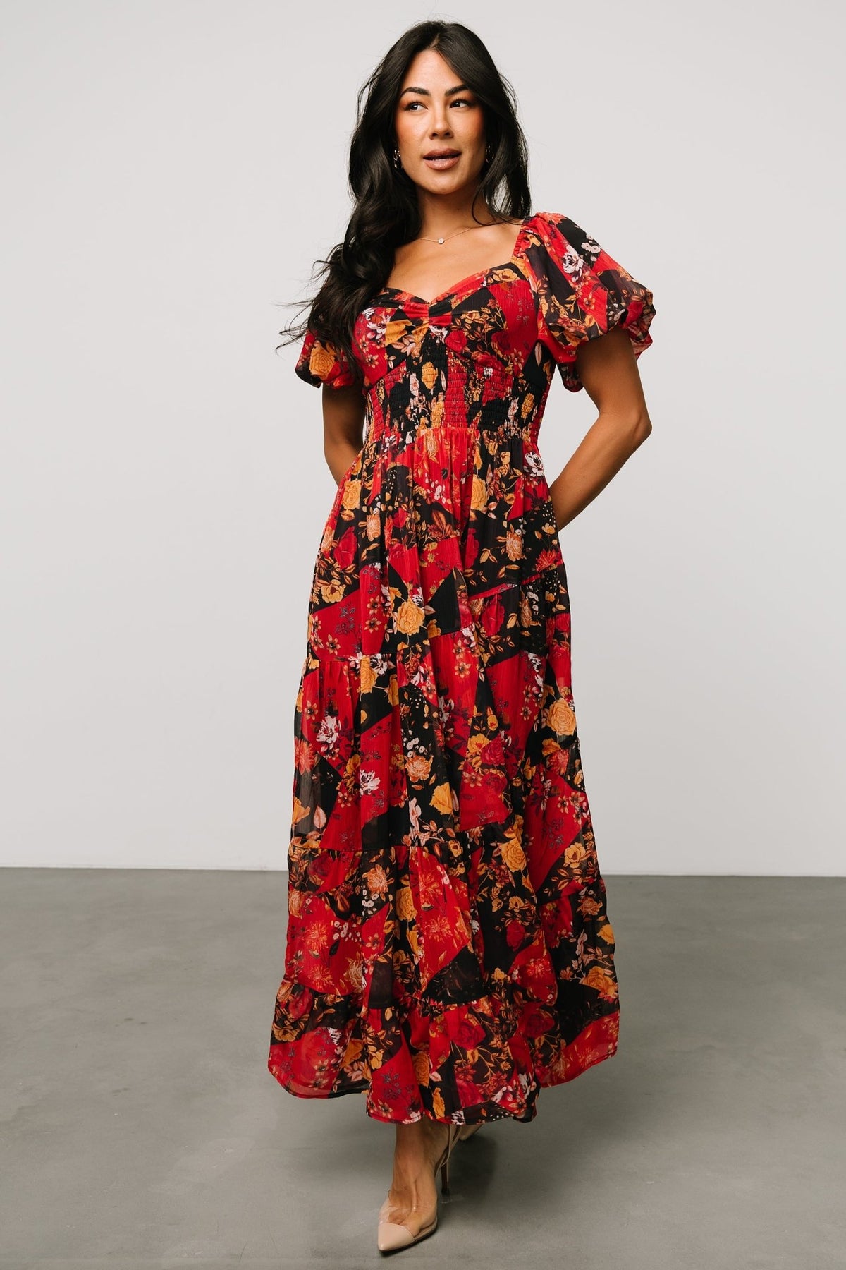 Full-length image of Suzy Maxi Dress in Black + Red Multi on model Skye (5'9") showcasing fit, length, and movement of the lined chiffon skirt.