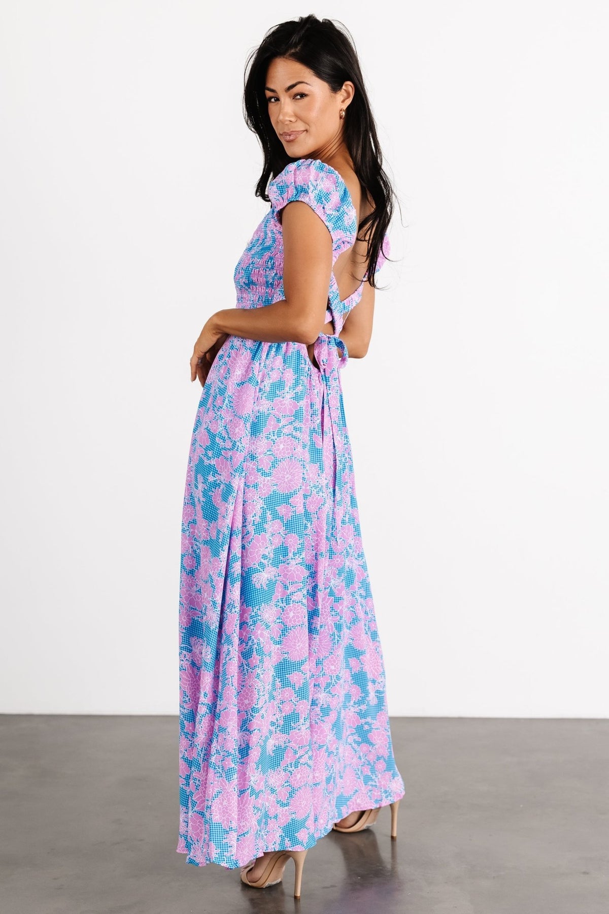 Full-length image of the Tabitha maxi in motion, showing the lightweight polyester skirt and knee lining for coverage.