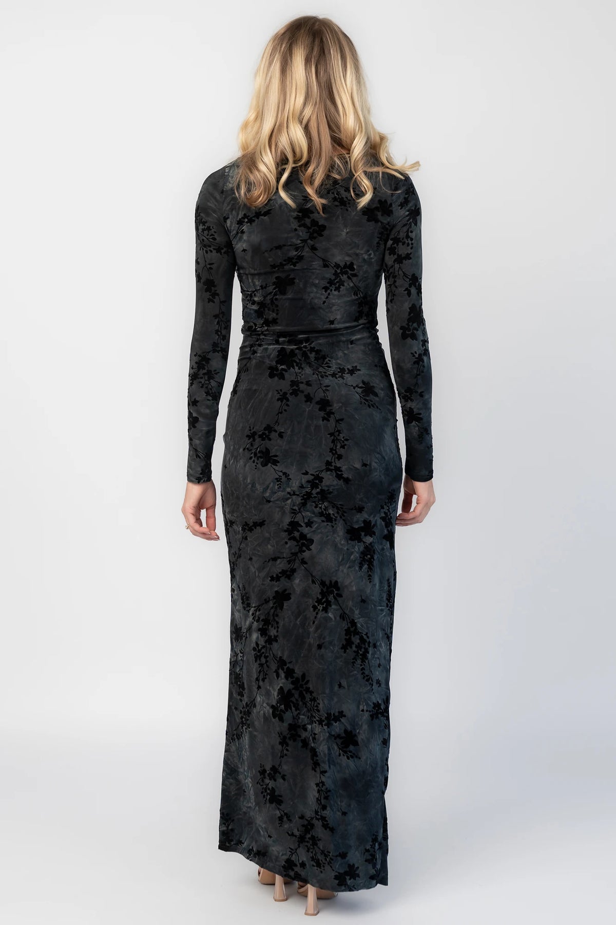 Tasha Maxi Dress in Black Multi with round neckline, sheer sleeves, and left leg slit.