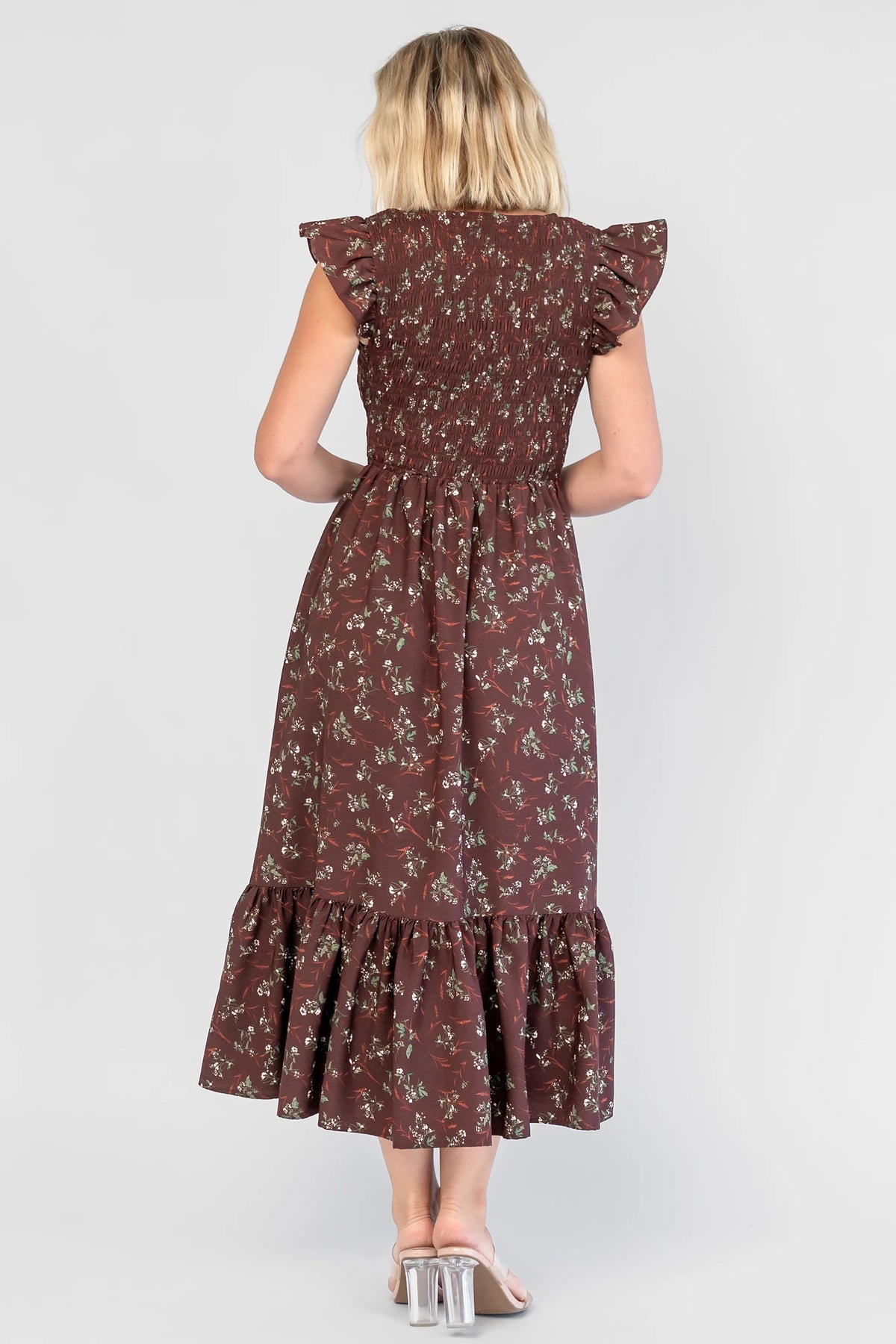 Tilly Smocked Dress in Dark Clove Floral with a V-neckline, flutter sleeves, and a smocked empire bodice.