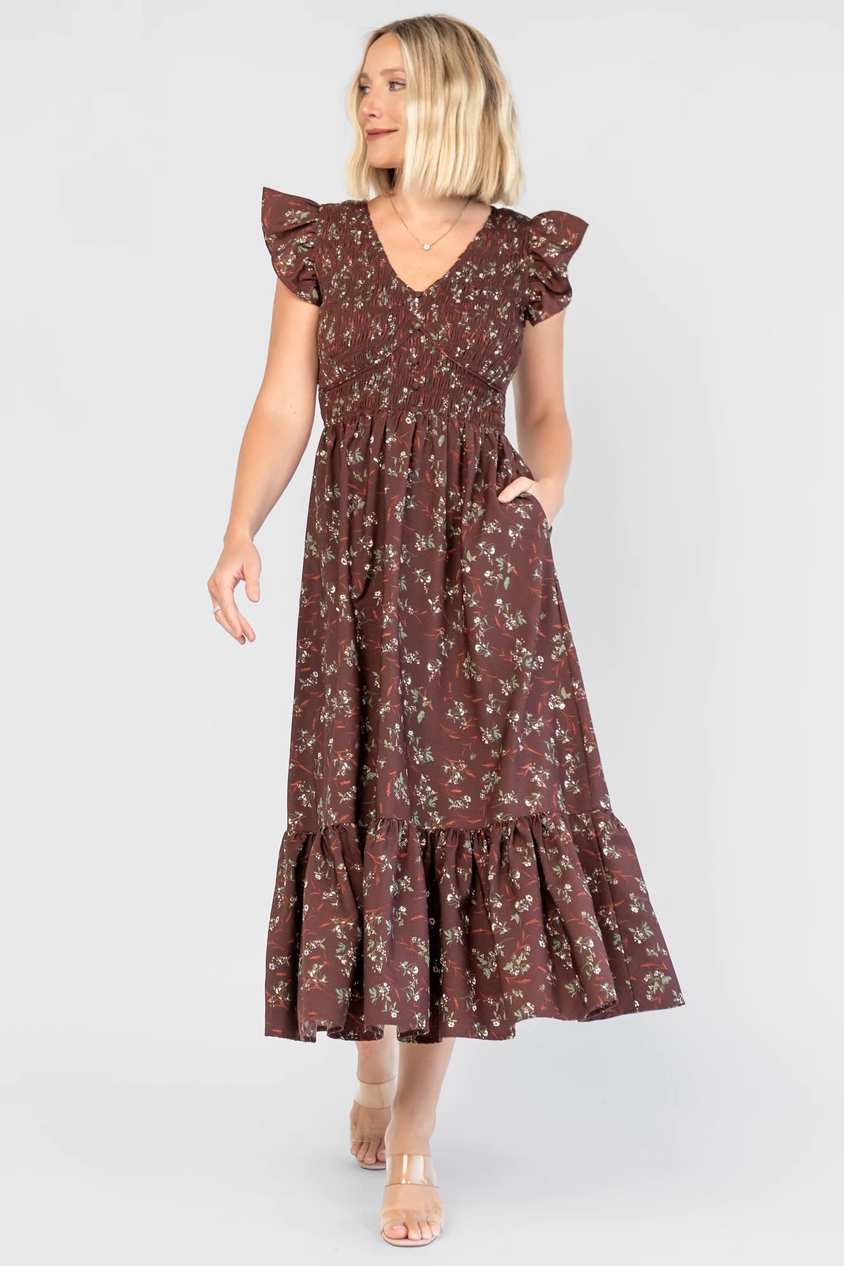 Tilly Smocked Dress in Dark Clove Floral with a V-neckline, flutter sleeves, and a smocked empire bodice.
