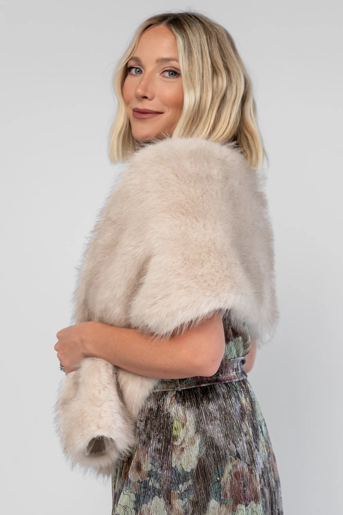 Torino Faux Fur Shawl in Warm Taupe with a soft faux fur finish and an elegant oversized draping silhouette.