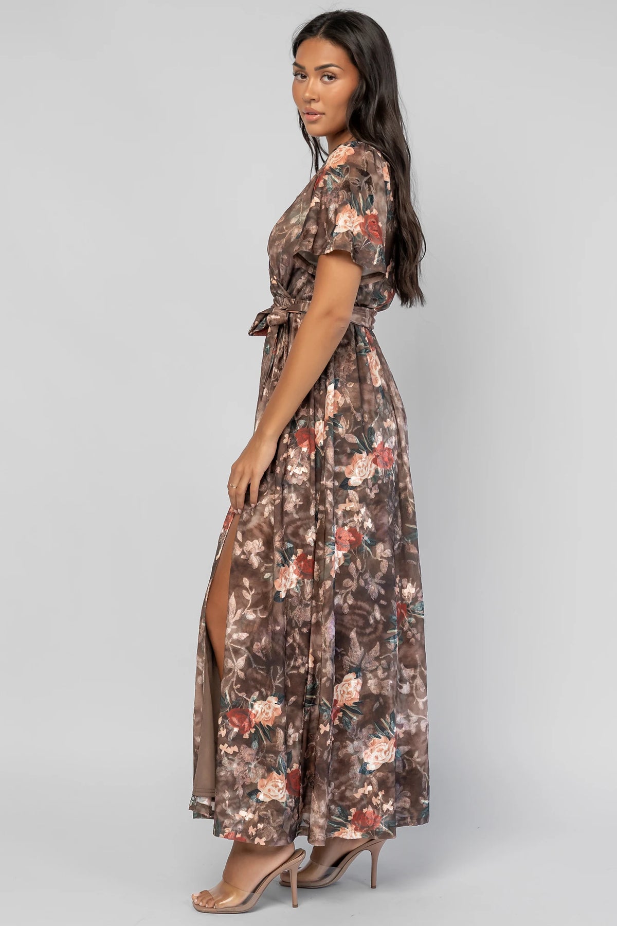 Uma Velvet Maxi Dress in Brown Floral with a burnout mesh overlay, crossover V-neckline, and a side leg slit.