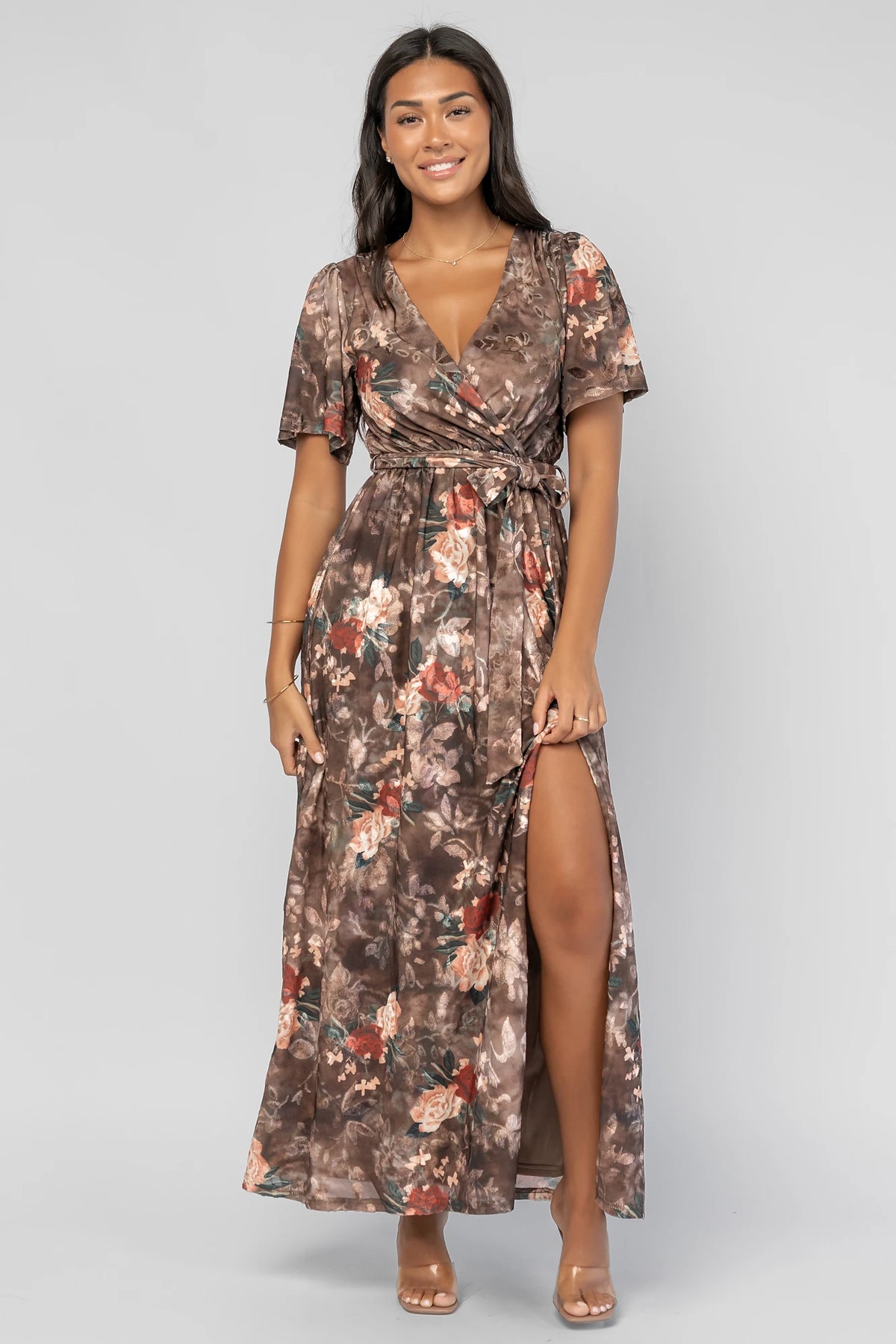 Uma Velvet Maxi Dress in Brown Floral with a burnout mesh overlay, crossover V-neckline, and a side leg slit.