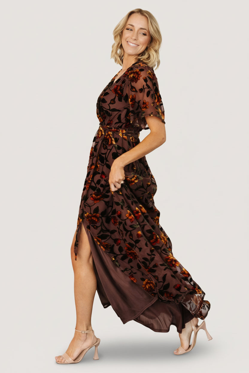 Hanging flat view of the clove velvet Uma dress with amber floral print, showing overall color, sheen, and skirt length.