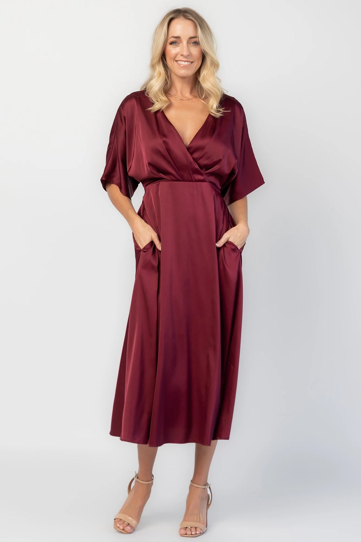 Veda Midi Dress in Burgundy with V-neckline, adjustable back tie, and hidden side pockets.