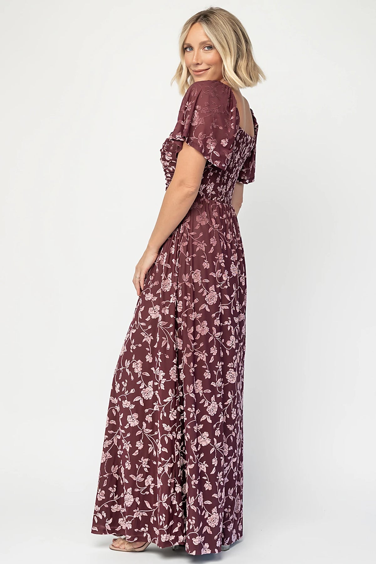 Veloura Maxi Dress in Mulberry Floral with sweetheart neckline, flutter sleeves, ruched bust, smocked back, and velvet florals.