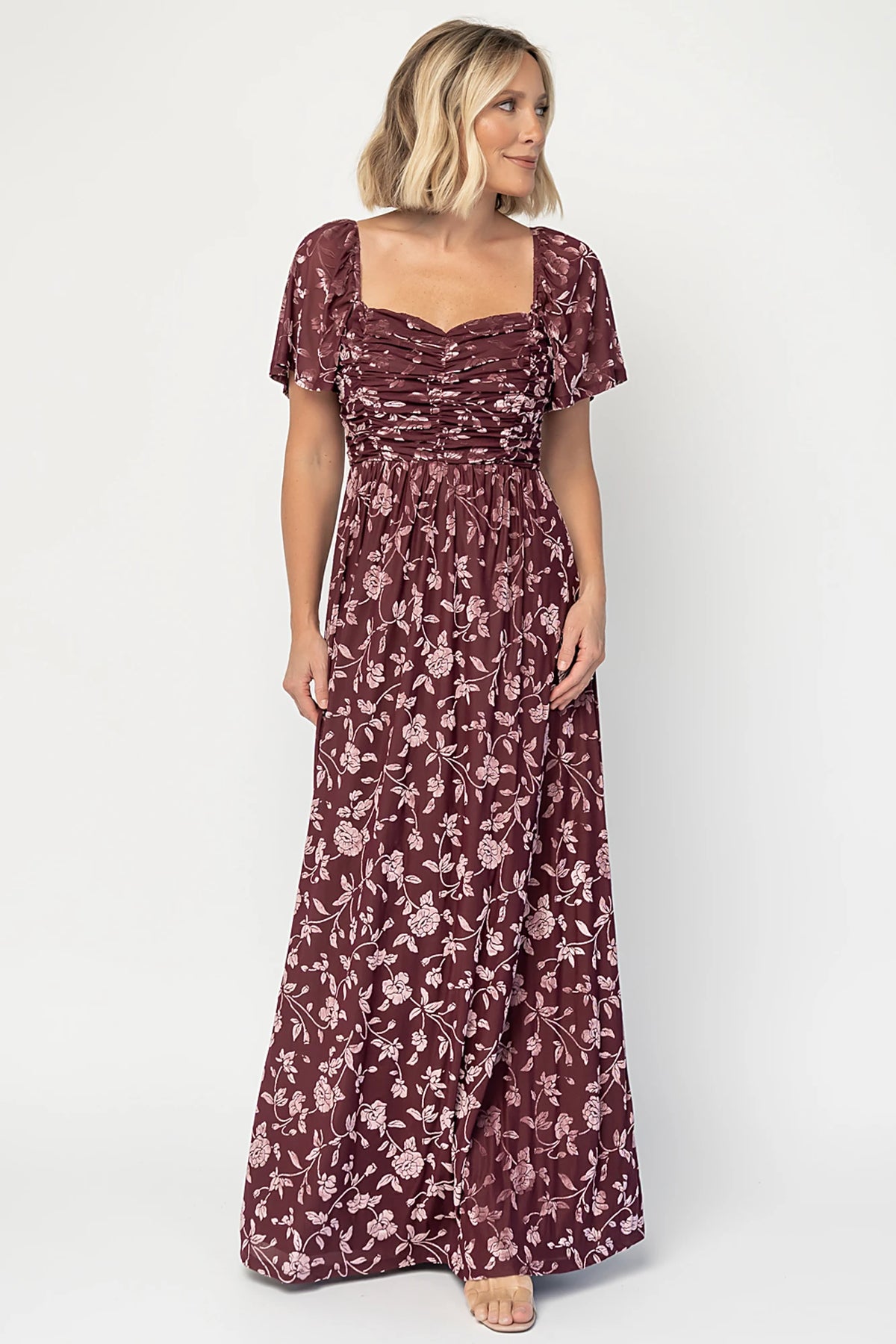 Veloura Maxi Dress in Mulberry Floral with sweetheart neckline, flutter sleeves, ruched bust, smocked back, and velvet florals.