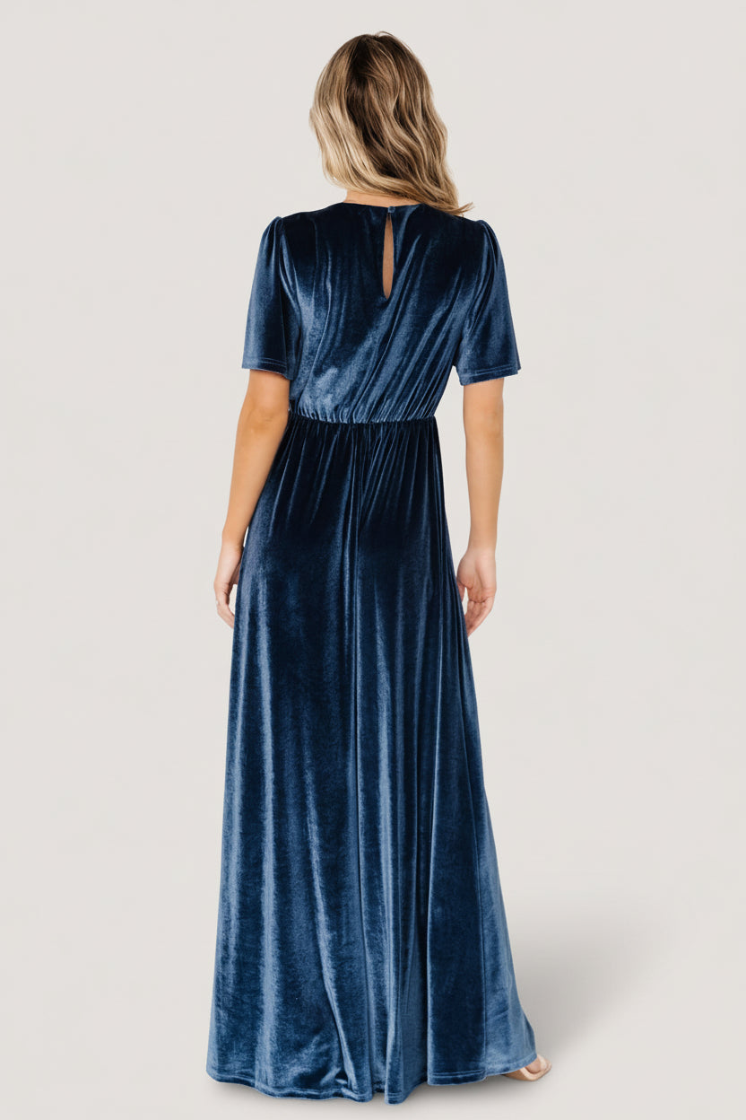 Detail view of bodice and sleeve of blue Vivian velvet maxi dress showing flutter sleeve edge, gathered bust, and subtle sheen of the fabric.