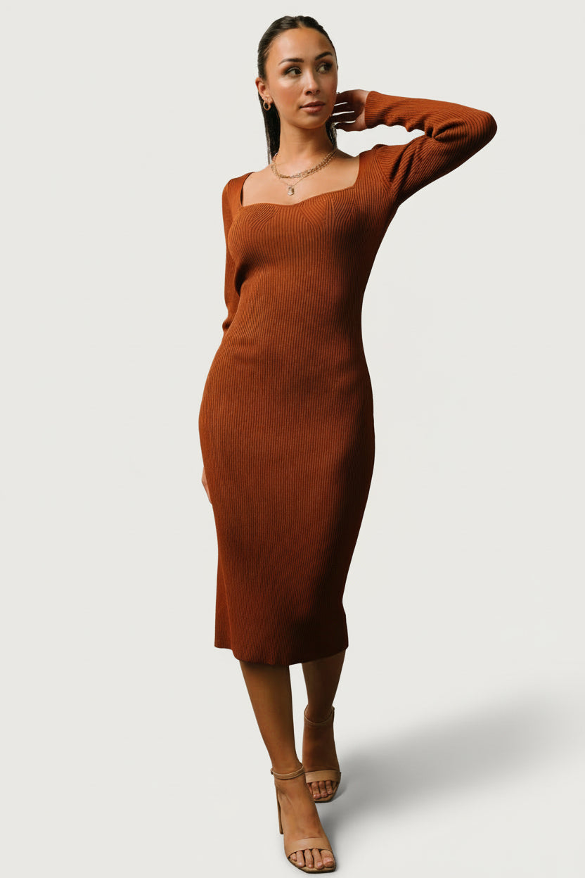 Front view of chestnut ribbed midi dress on model showing sweetheart neckline, long sleeves, and body-hugging silhouette for evening wear.