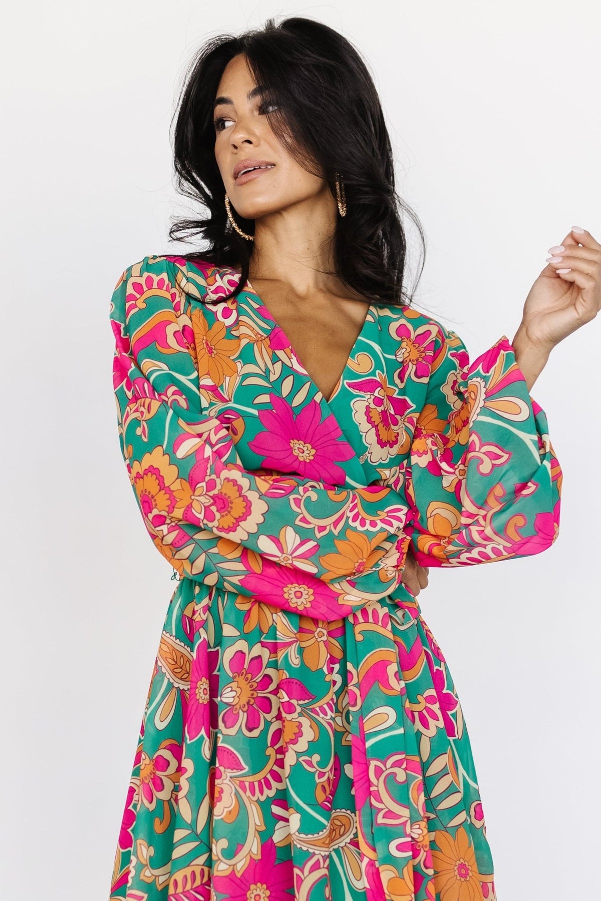 Close-up of crossover V-neck and snap closure on the Wesley Mini Dress; shows lined bodice and snap placement for modest coverage.