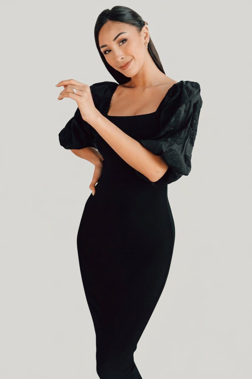 Detailed shot of the dress hem and fabric drape, showing the viscose blend's stretch recovery and smooth finish at the skirt edge.