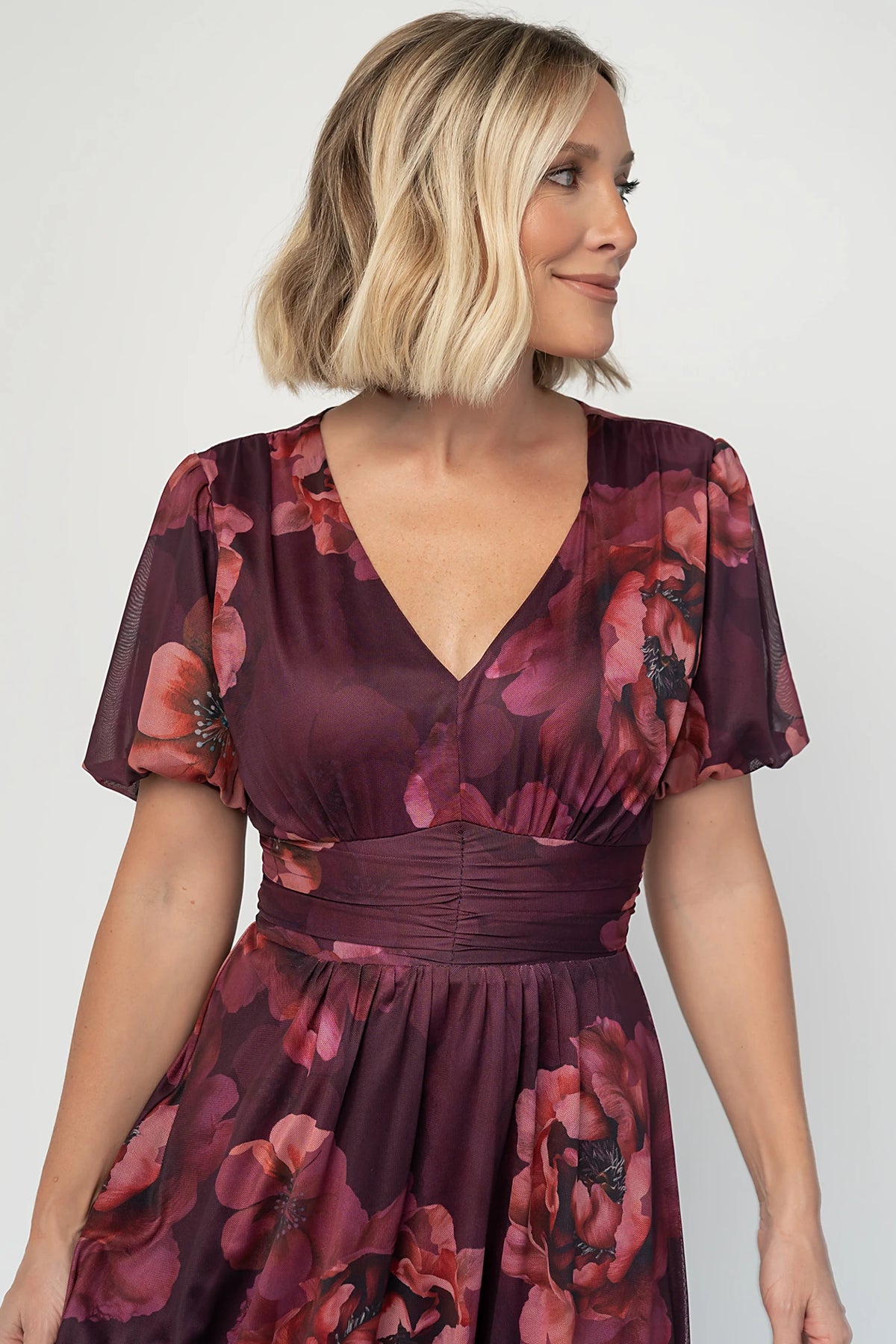 Whitney Mesh Maxi Dress in Deep Berry Floral with deep V-neck, short sleeves, empire waist, and flowing skirt.