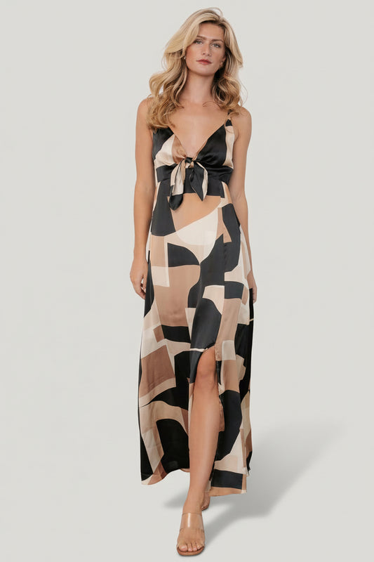 Front view of Xanthe slip dress in midnight with taupe print, showing gathered bust, front tie and fluid satin drape.