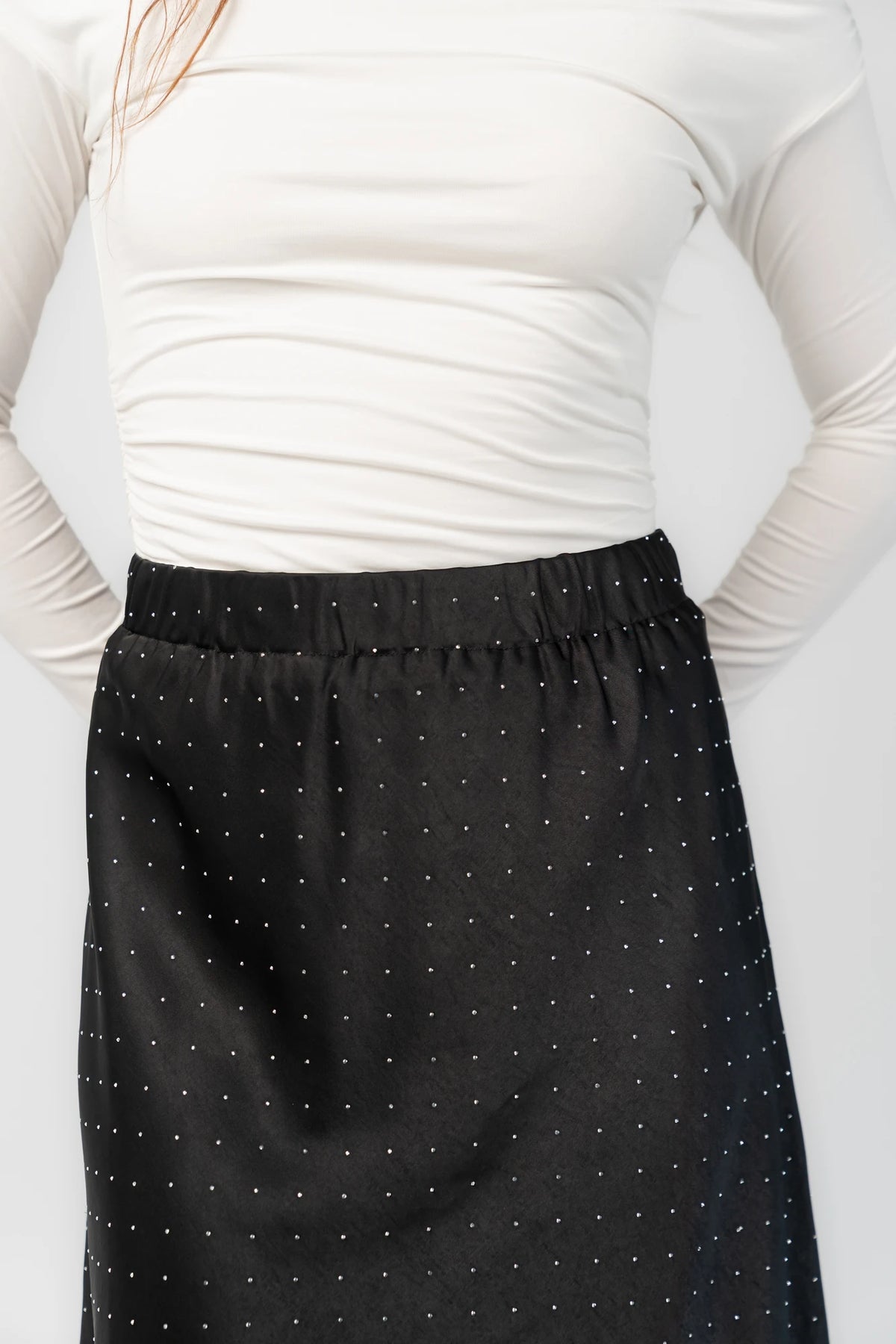 Zaylee Skirt in Black with rhinestone embellishments, elastic waistband, and flowing maxi silhouette.
