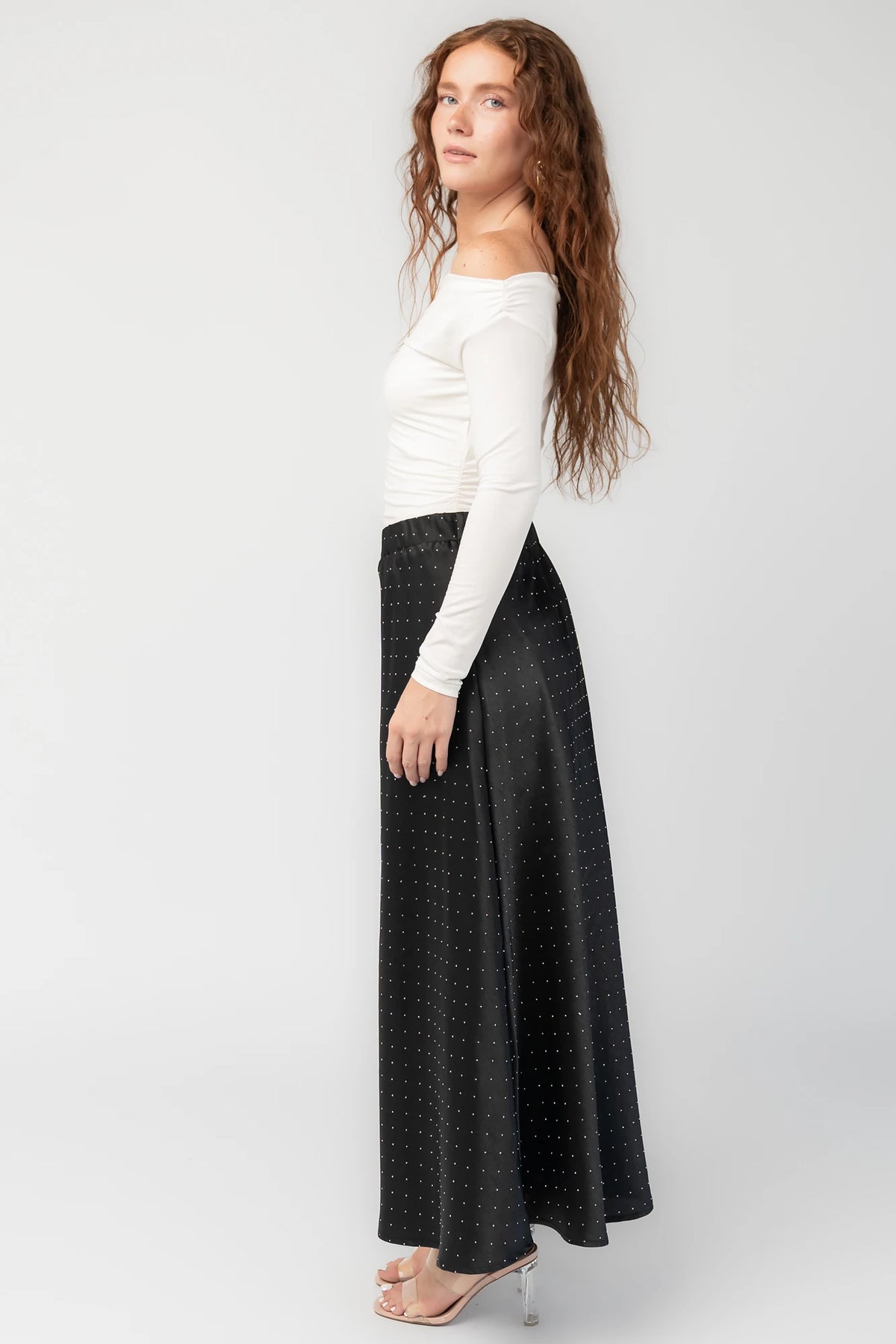 Zaylee Skirt in Black with rhinestone embellishments, elastic waistband, and flowing maxi silhouette.