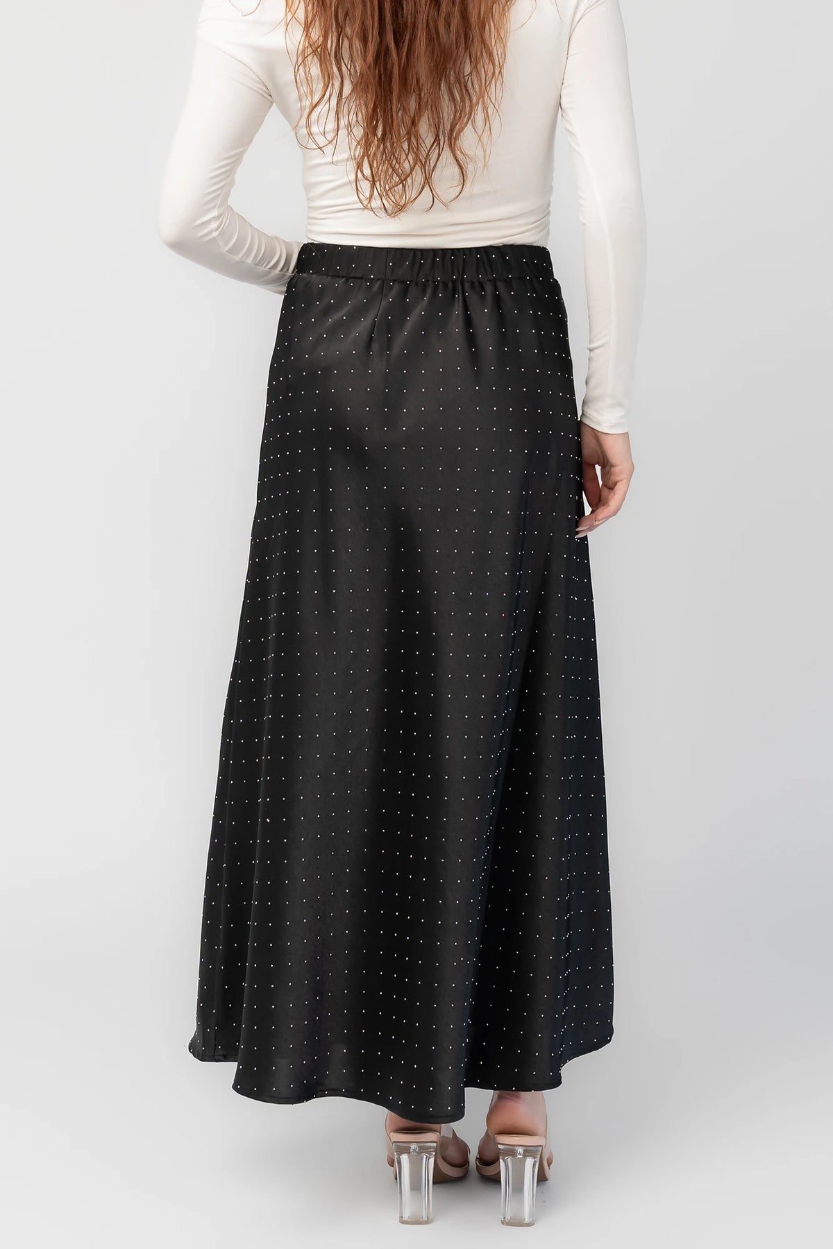 Zaylee Skirt in Black with rhinestone embellishments, elastic waistband, and flowing maxi silhouette.