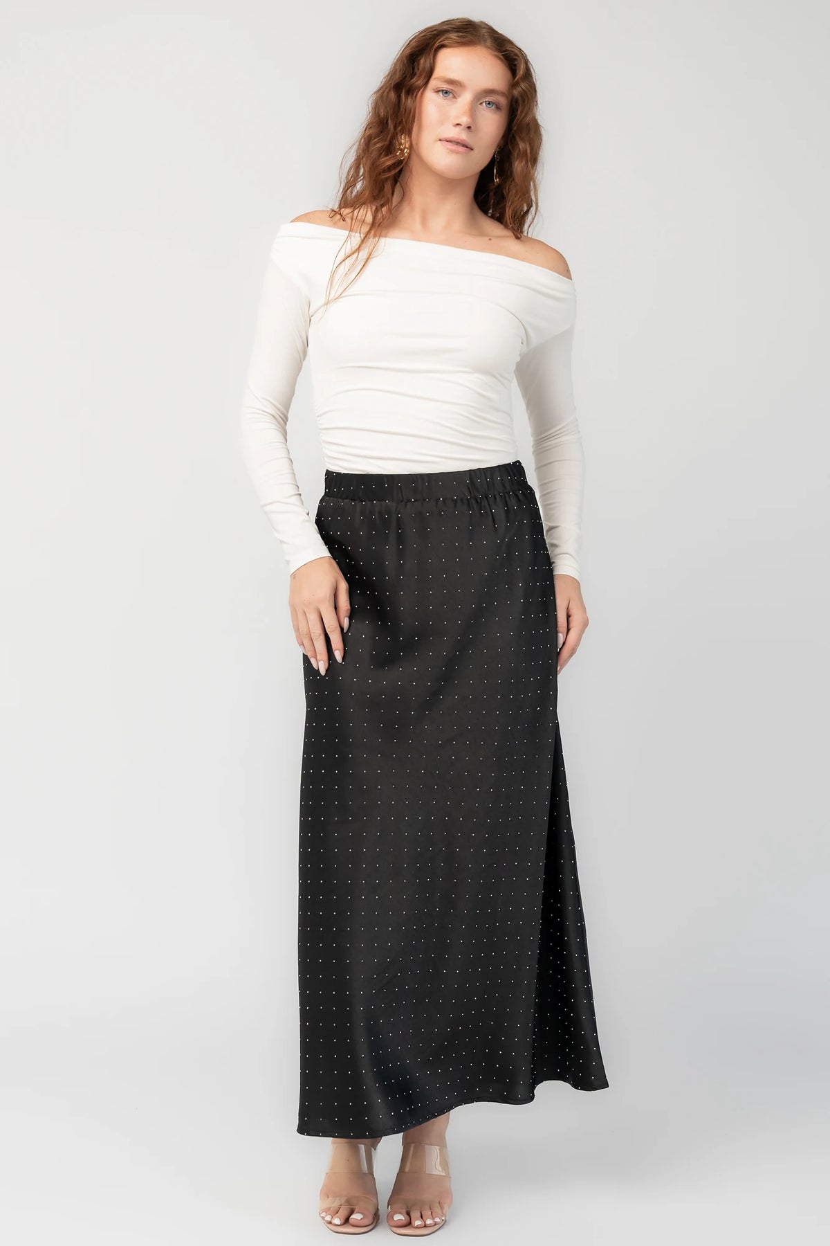 Zaylee Skirt in Black with rhinestone embellishments, elastic waistband, and flowing maxi silhouette.