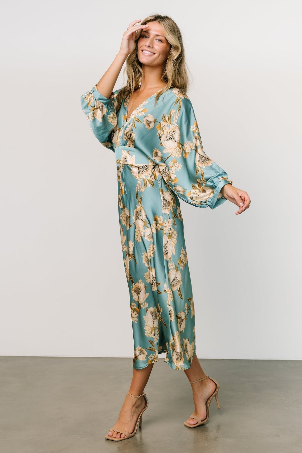 Close-up of fabric and floral print on Joni Satin Midi Dress, showing silky satin sheen and blue, gold, cream tones.