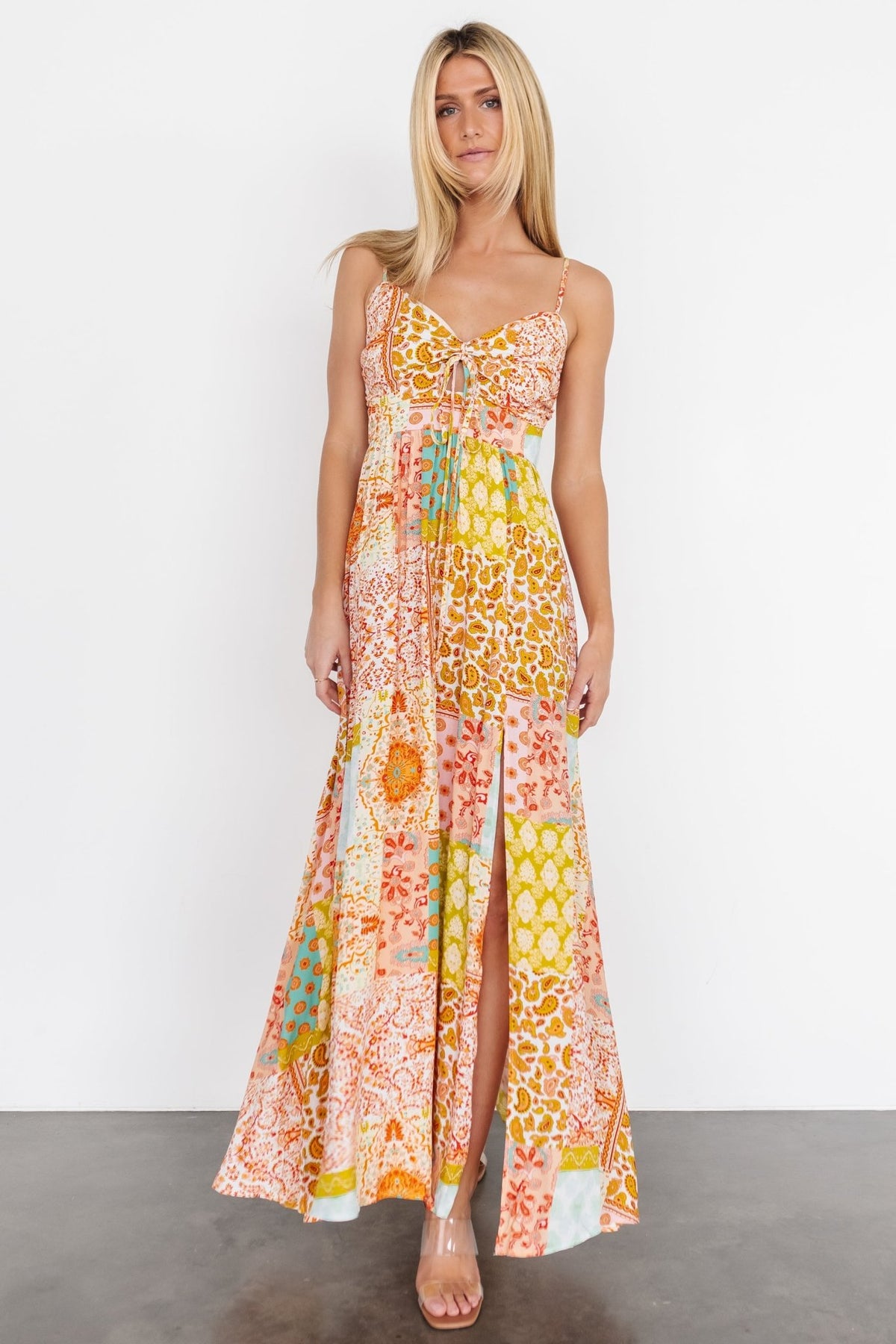 Model wearing Kamari Tank Maxi Dress in multi-print; shows overall length, movement, and styling with sandals.