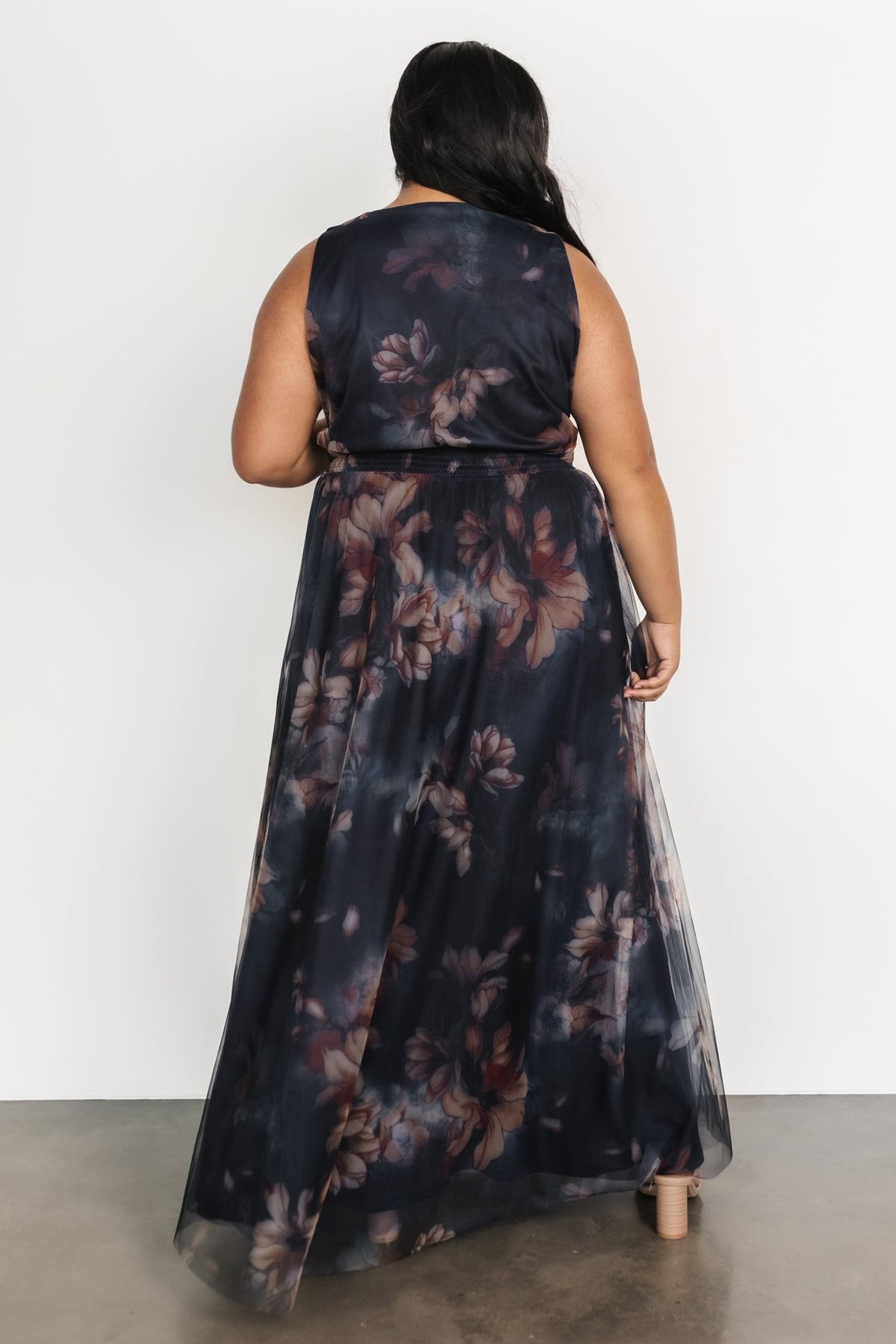 Styled detail shot of the dress paired with delicate accessories, focusing on neckline, sleeves and upper bodice fit.