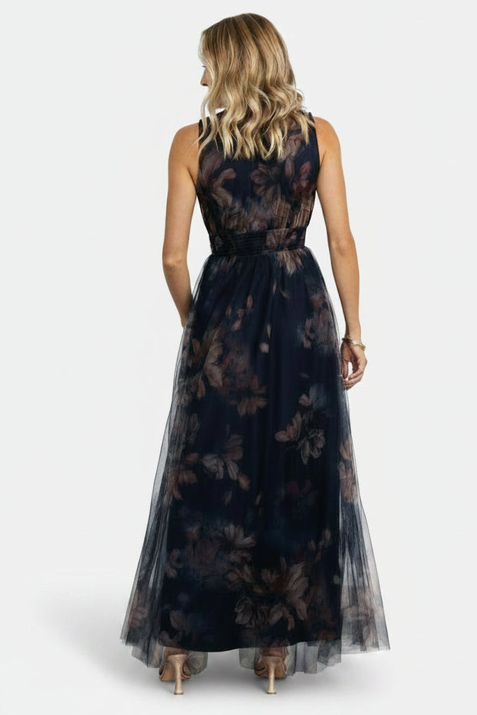 Full-length studio shot of the dark blue floral tulle maxi dress on a model, emphasizing length and event-ready styling.