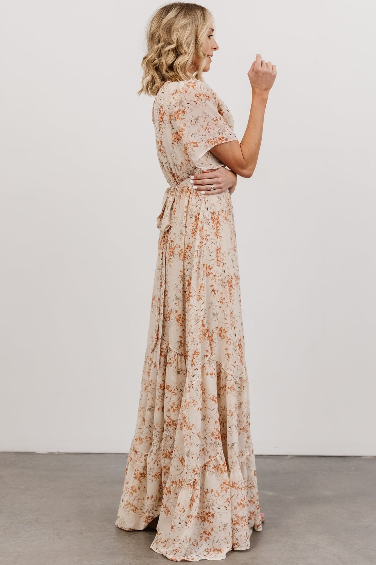 Close fabric detail of cream base with rust and tan floral pattern, highlighting print scale and soft chiffon texture.