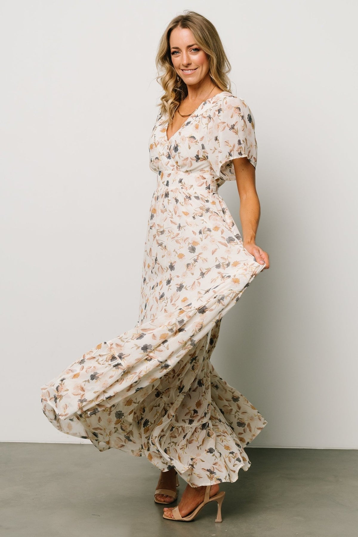 Detail image of waist ties and gathered waist showing adjustable shaping and subtle texture of polyester chiffon.