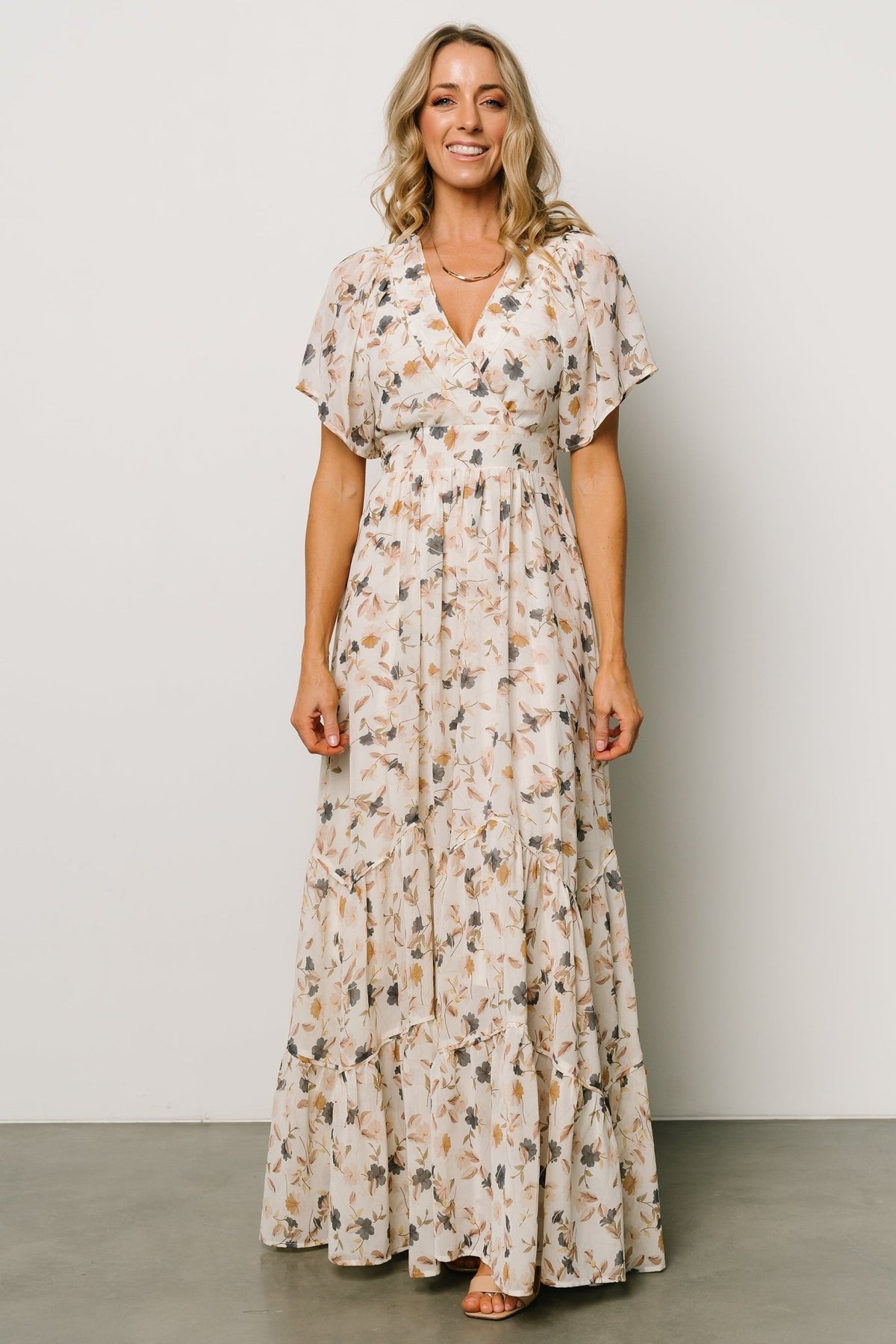 Back view of Katherine maxi dress showing keyhole closure, back neck detail, and attached waist ties for shaping.