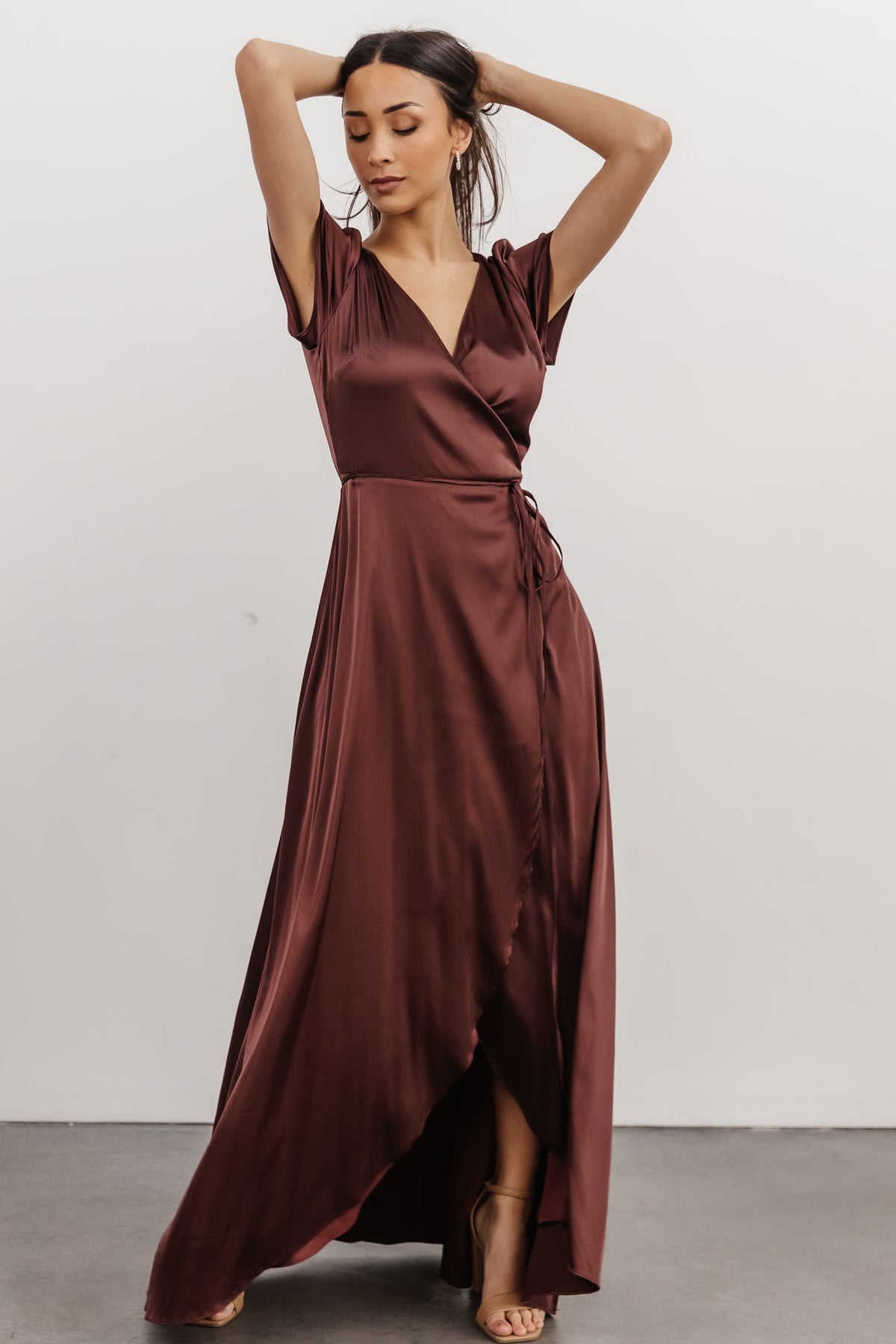 Detail image of Krystal Satin Wrap Gown fabric in dark clove to show sheen, subtle stretch and smooth finish of the satin blend material.