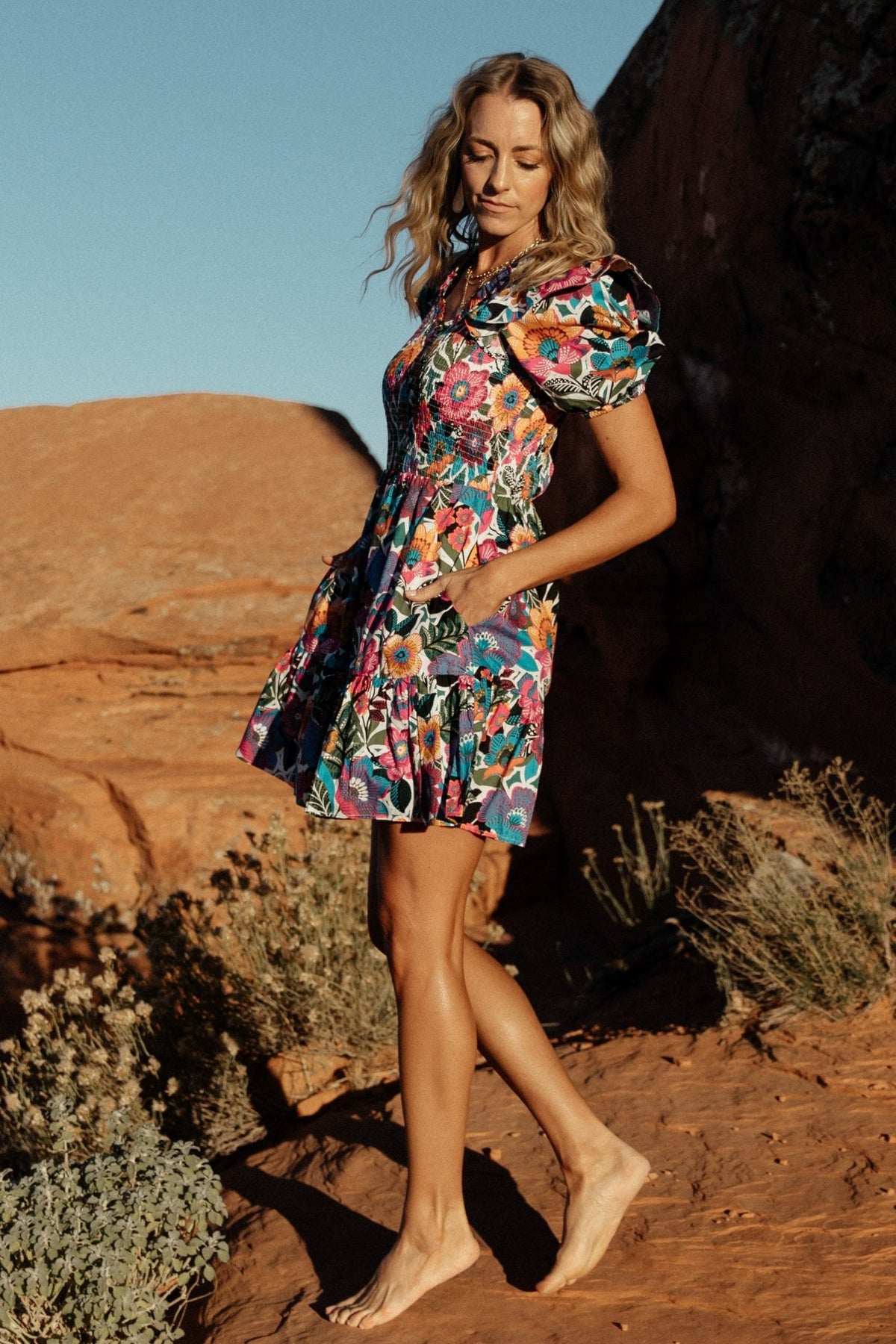 Back and full-length view of Kyrie Puff Sleeve Short Dress in white multi floral, highlighting short length, ruffled tiers, and overall fit.