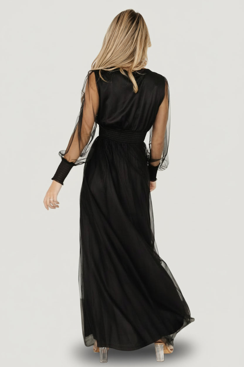 Close-up of the smocked waist and textured tulle fabric on the black Layla Maxi Dress, showing elastic detail and layered skirt finish.