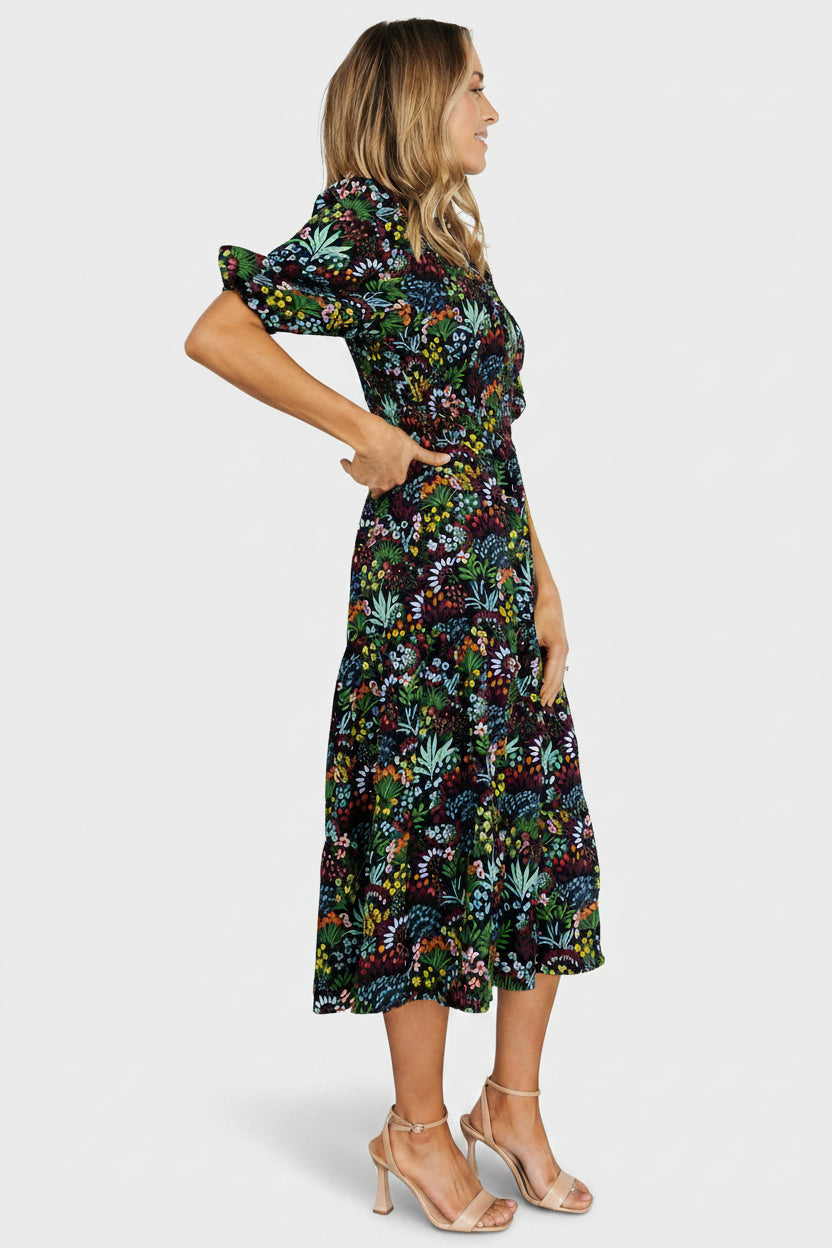 Close-up of smocked bodice and elastic waistband on Lena Tiered Midi Dress in black multi floral, showing stretch detail and delicate chiffon texture.