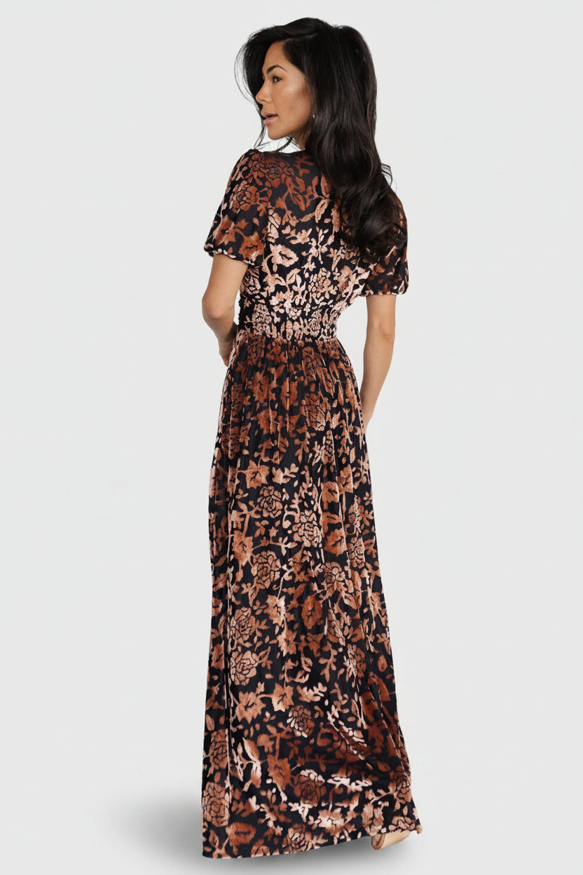 Side view of Leslie maxi dress in Black + Bronze showing pocket placement, skirt drape, and short puff sleeve silhouette.