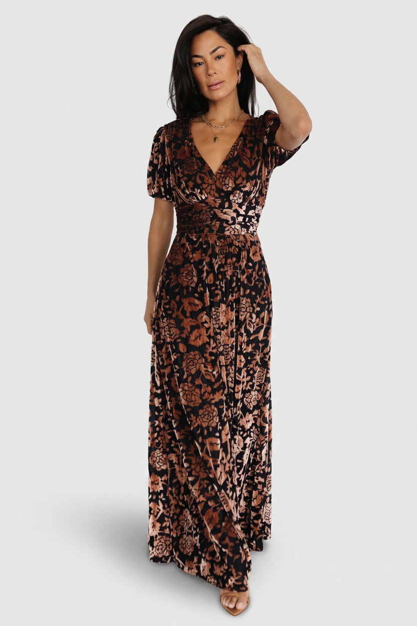 Front view of Leslie embossed velvet maxi dress in Black + Bronze showing V-neck, gathered waist, and flowing skirt for full-length silhouette.