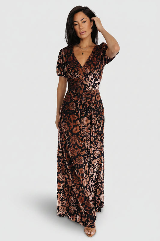 Front view of Leslie embossed velvet maxi dress in Black + Bronze showing V-neck, gathered waist, and flowing skirt for full-length silhouette.