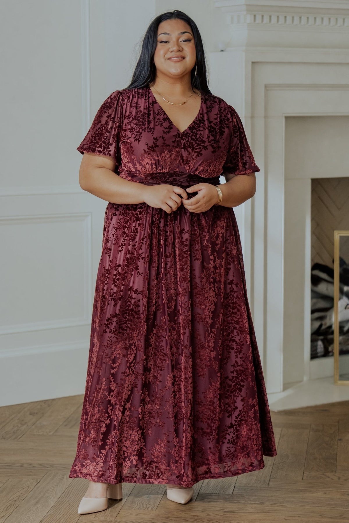 Close-up of Mulberry embossed velvet fabric and floral print, highlighting texture, rich color and subtle sheen.