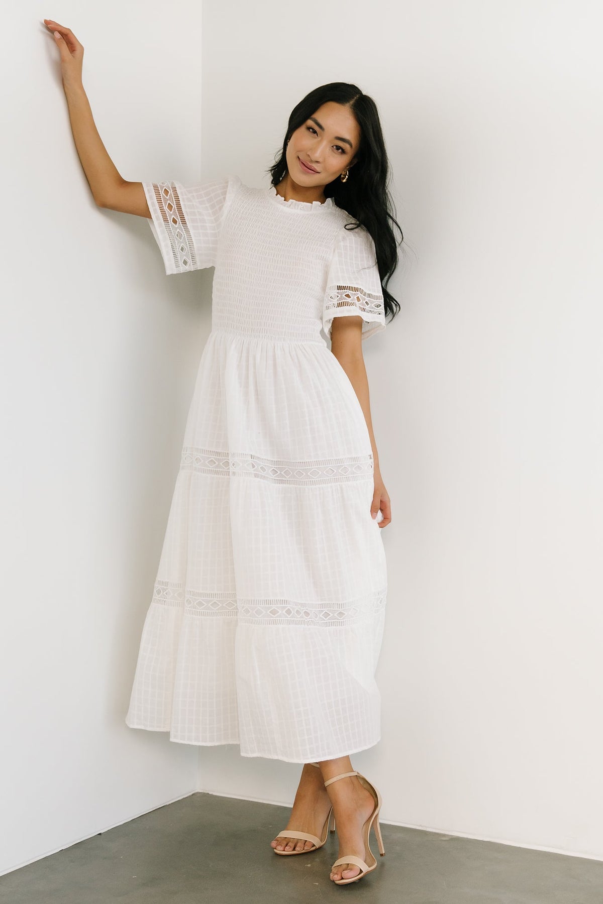 Detail of oversized short sleeve and lace edging on off-white Loveland Geo Lace Maxi Dress, highlighting sleeve shape.