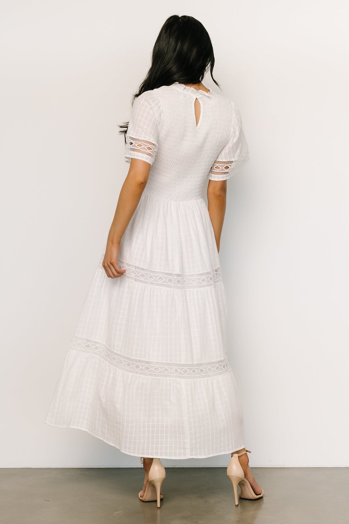 Studio image of Loveland Geo Lace Maxi Dress laid-flat, showing geo lace texture, lining and construction details in off-white.