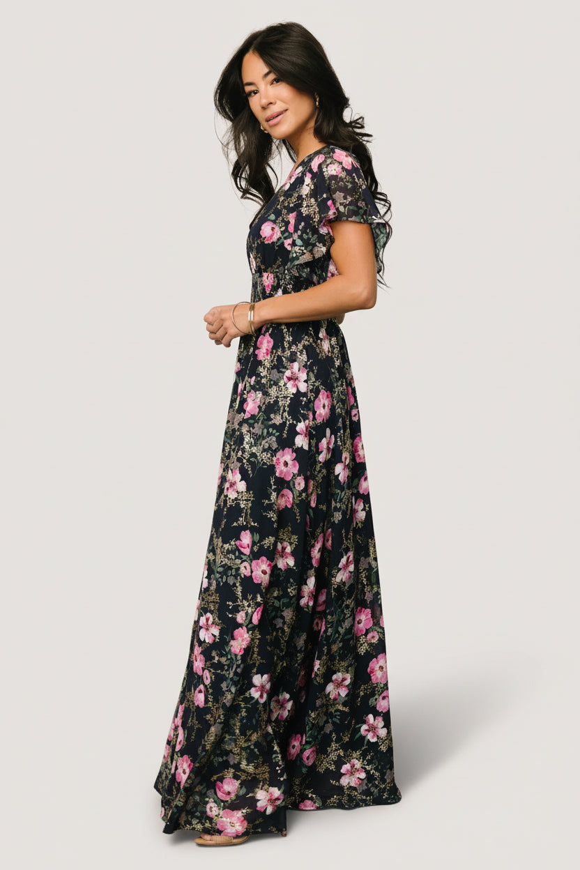 Styled look of the Lynlee metallic maxi dress in dark blue + pink on model, paired with minimal accessories to highlight the shimmer and silhouette.