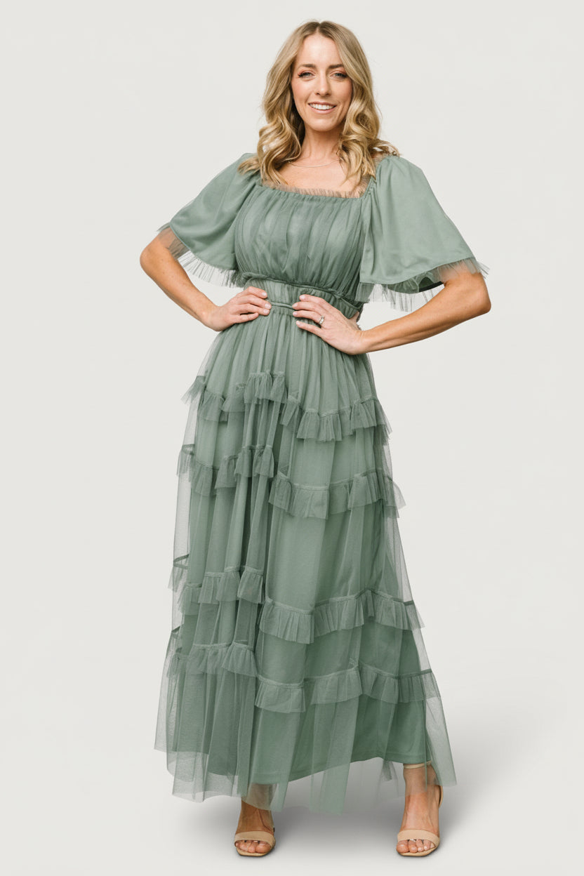 Front view of Magdalena Tulle Maxi Dress in dark eucalyptus on a model, showing square ruffle neckline and tiered tulle skirt.