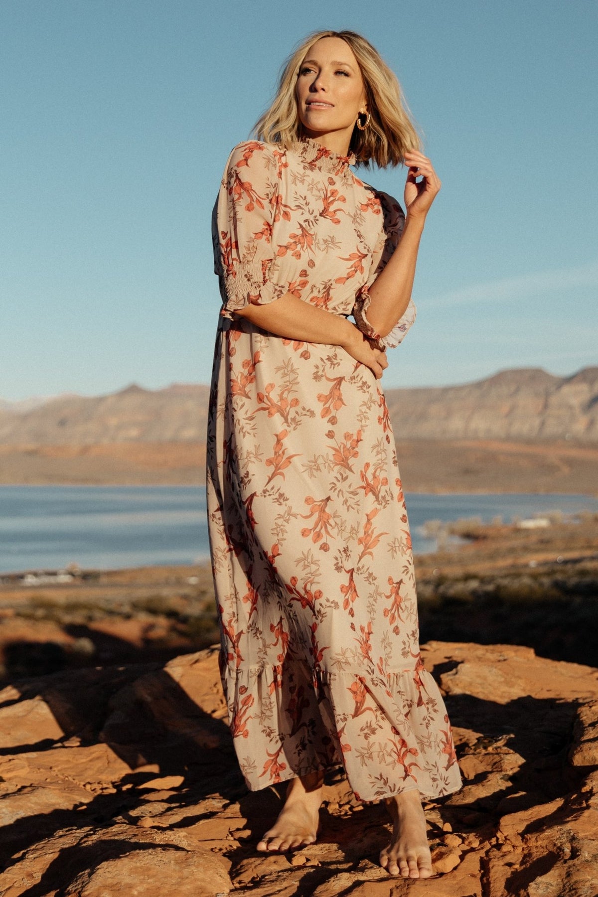 Detail shot of blush floral chiffon showing fabric print and lining edge; illustrates single-tier skirt and lightweight polyester weave.