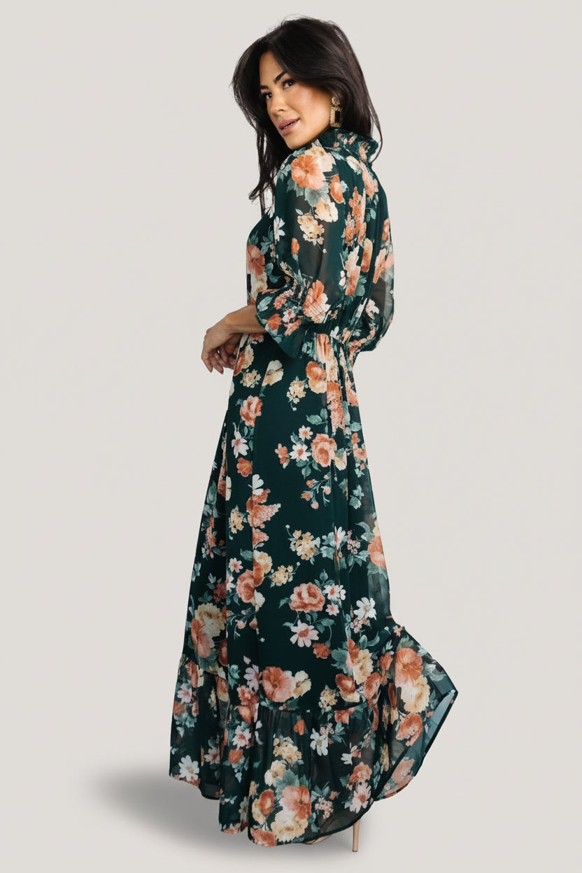 Back view of Marie mock neck maxi dress highlighting keyhole with double-button closure and elasticized back waist in floral chiffon.