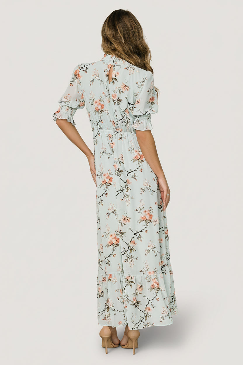 Full-length shot of Marie Mock Neck Maxi Dress in sage floral print, showing modest coverage, mock neck silhouette and flowing maxi length.
