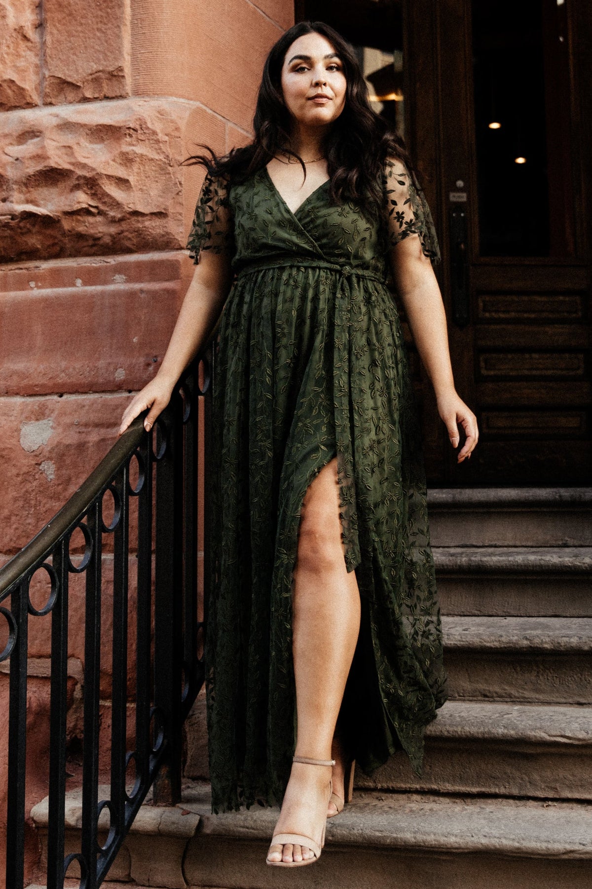 Model wearing the olive Marseille embossed organza maxi dress, highlighting full length, soft drape, and textured vine detail across the bodice.