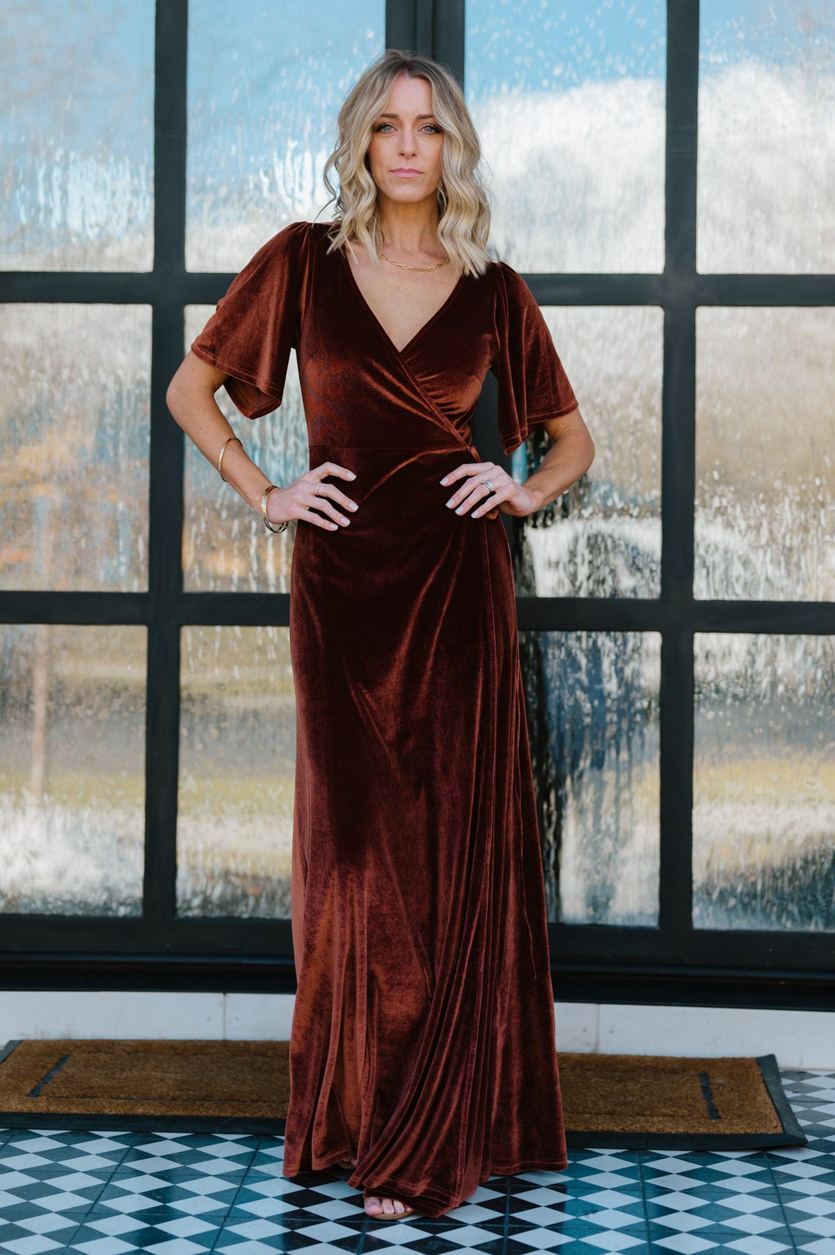 Back view of Meghan velvet wrap maxi dress in bronze, showing skirt length, gentle flare and how the wrap sits at the waist.